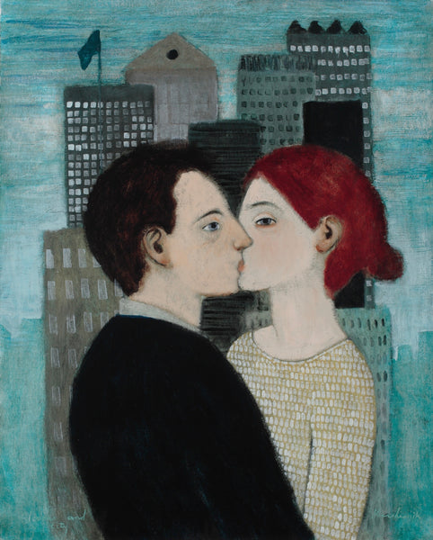A couple kissing against a cityscape background and turquoise sky. She is weary beige and white top and he is in black.